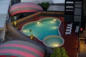 an overhead view of a swimming pool on a building at Elissa Hotel & Suites in Kangar