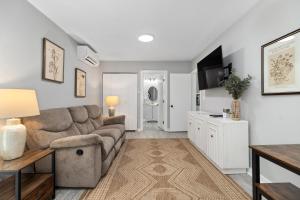 a living room with a couch and a tv at Gum Tree 3 with Wintergreen Advantage in Wintergreen