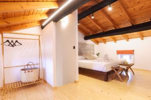 Postel nebo postele na pokoji v ubytování Casa Aretousa 1886