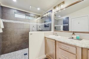 a bathroom with a shower and a sink and a mirror at Meadowpine Retreat in Donnelly +22 photos