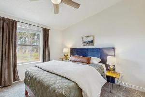 a bedroom with a large bed and a window at Meadowpine Retreat in Donnelly