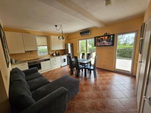 a living room with a couch and a table at Villa Rolla in Tivat
