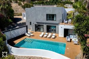 an aerial view of a house with a swimming pool at Villa Chic Romance by Abahana Villas in Fanadix +19 photos