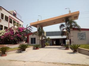a building with plants and flowers in front of it at lotuspond resort and spa in Jāmb