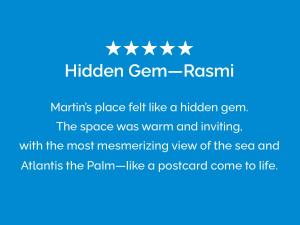 a line of stars with a hidden gemishi mountains place felt like a hidden gem at Atlantis View 1BR with Beachfront Access and Balcony in Dubai +41 photos