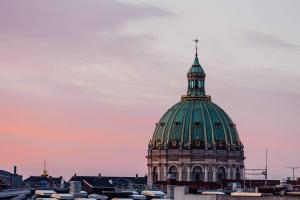 a domed building with a cross on top of it at Nice 1-bed in Østerbro - 279 in Copenhagen