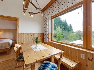 a room with a wooden table and a window at Alpine Hut in Eberstein near Ski Area in Eberstein