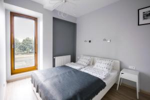 Postel nebo postele na pokoji v ubytování Homewell Apartments Stare Miasto