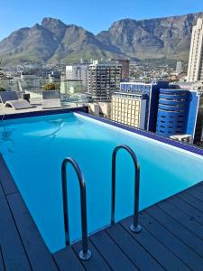 a swimming pool on the roof of a building at Tokapa, a place between worlds in Cape Town