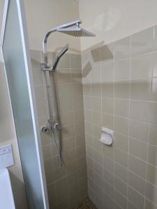 a bathroom with a shower with a shower head at Advantage house in Kelmscott +16 photos
