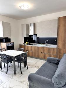 a living room with a table and a kitchen at a casa di Luca in Florence +9 photos