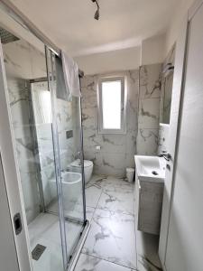 a bathroom with a shower and a toilet and a sink at a casa di Luca in Florence