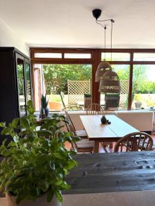 a dining room with a table and chairs at Strandbude 4 in Dahme