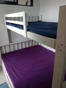 En eller flere senge i et værelse på RY Nest Pad 2