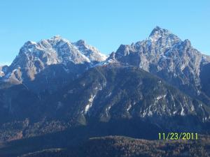 a view of a mountain range with snow capped mountains at Cajosftan in Ftan