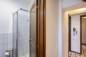 a bathroom with a shower and a mirror at La Casa di Nonno Sallù by Wonderful Italy in Camogli +16 photos