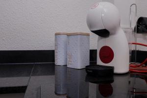 a white blender sitting on top of a table at Cocon Montabo Studio climatisé avec terrasse et parking proche plage université et centre ville in Cayenne