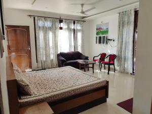 a bedroom with a bed and a living room at Rupayan in Palāhu