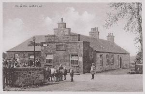 a group of people standing in front of a building at The Old School-Annexe in Scotlandwell