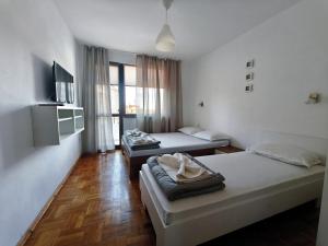 Ένα ή περισσότερα κρεβάτια σε δωμάτιο στο Yanevi Apartments