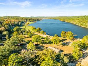 an aerial view of a lake in the fall at YMCA Trout Lodge in Potosi