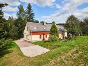 an aerial view of a house with a yard at Spacious Mountain Retreat in Lampertice +32 photos