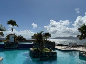a swimming pool with a view of the water at C206 - Sapphire Beach - Sapphire Jewel VI in East End