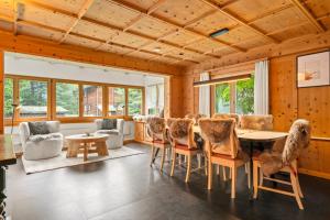 a dining room with a table and chairs at A&Y Chalet Davos Central in Davos