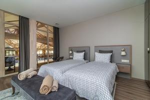 a bedroom with two beds with pillows on it at Royal Horse Resort in Balkasodis +174 photos