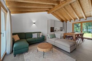 a living room with a couch and a table at Abitaziun Stauffacherin 3 - Pontresina in Pontresina
