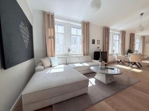 a living room with a couch and a table at designAparts - II - by MorenoPisano in Bayreuth