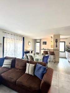 a living room with a couch and a table at La Bulle Familiale in Angoulême