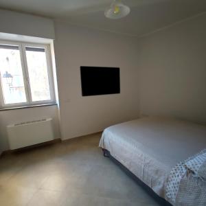 Postel nebo postele na pokoji v ubytování Casa Campanile Giungano