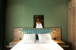 Ένα ή περισσότερα κρεβάτια σε δωμάτιο στο Central Hotel Kutaisi