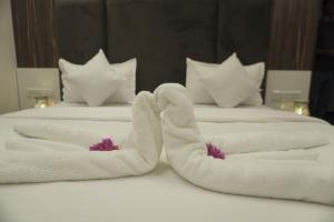 Postel nebo postele na pokoji v ubytování Hotel Decent