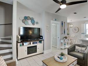 a living room with a flat screen tv at Bungalows at Seagrove #138 in Seagrove Beach