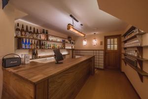 a bar with a wooden counter in a room at Chongqing Youwu Hotel -Jiefangbei in Chongqing