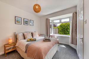 a bedroom with a bed and a large window at Beacon View in Braunton +33 photos