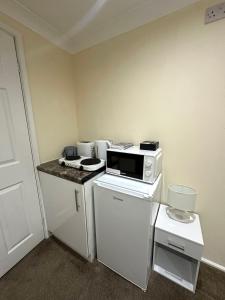 Η κουζίνα ή μικρή κουζίνα στο Cozy Self-Contained Studio
