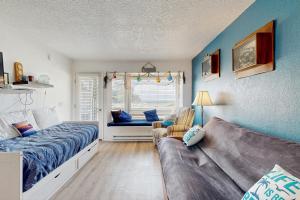 a living room with a couch and a bed at Neskowin Resort Unit #203 in Neskowin +26 photos