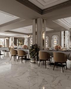 a dining room with tables and chairs and ceilings at Shirvan Grand Hotel Shamakhi in Şamaxı