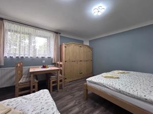 Postel nebo postele na pokoji v ubytování Párty penzion Dolany