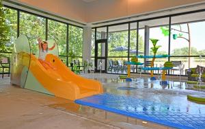 a child on a slide in a water park at Spring Mill Inn in Mitchell