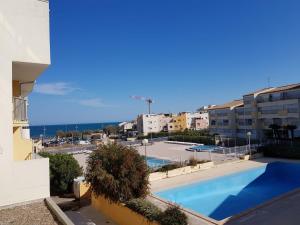 a view of a swimming pool from a building at Apartment with pool included in Agde +9 photos
