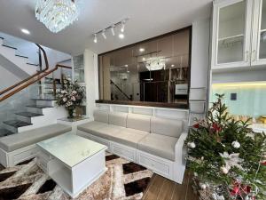 a room with a white bench and a staircase at Tiên Hoa Sơn Villa in Da Lat