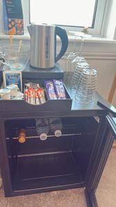a table with food and drinks on top of it at Kenavara House in Oban