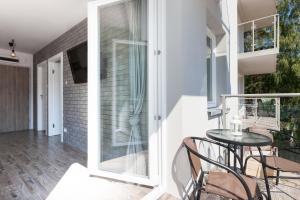 Balkón alebo terasa v ubytovaní Apartament Szczęśliwa Dziewiątka