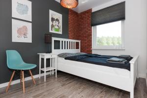 Posteľ alebo postele v izbe v ubytovaní Apartament Szczęśliwa Dziewiątka