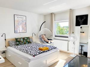 Ένα ή περισσότερα κρεβάτια σε δωμάτιο στο Zuhause auf Zeit-Gemütliche Gästezimmer