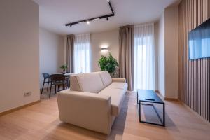 a living room with a couch and a table at Oriana Homèl Milano in Milan